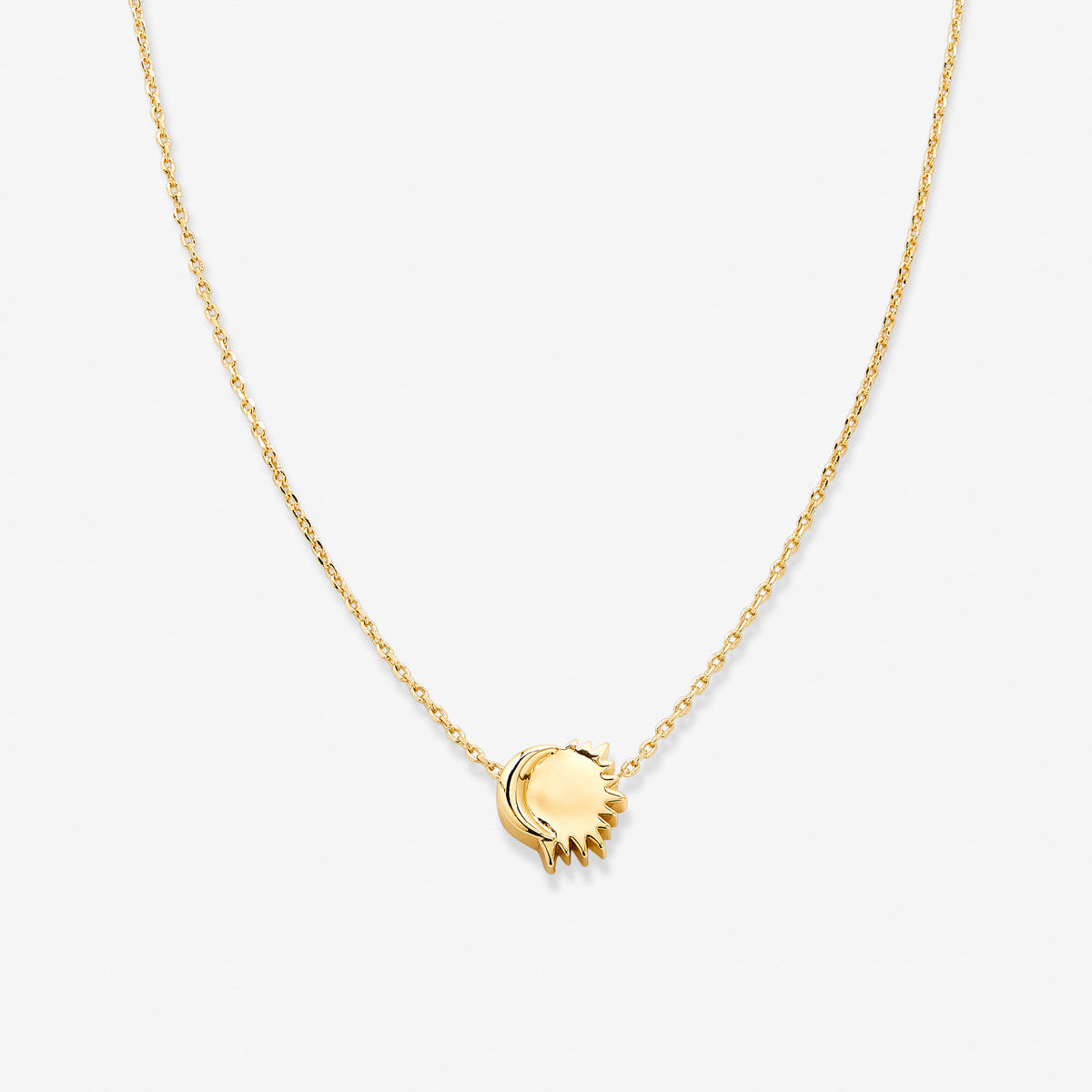 Close-up of a 14k gold-plated celestial necklace featuring a radiant sun and crescent moon pendant on a delicate chain, showcasing its elegant and zodiac-inspired design. Perfect for astrology lovers and as a meaningful gift for women.