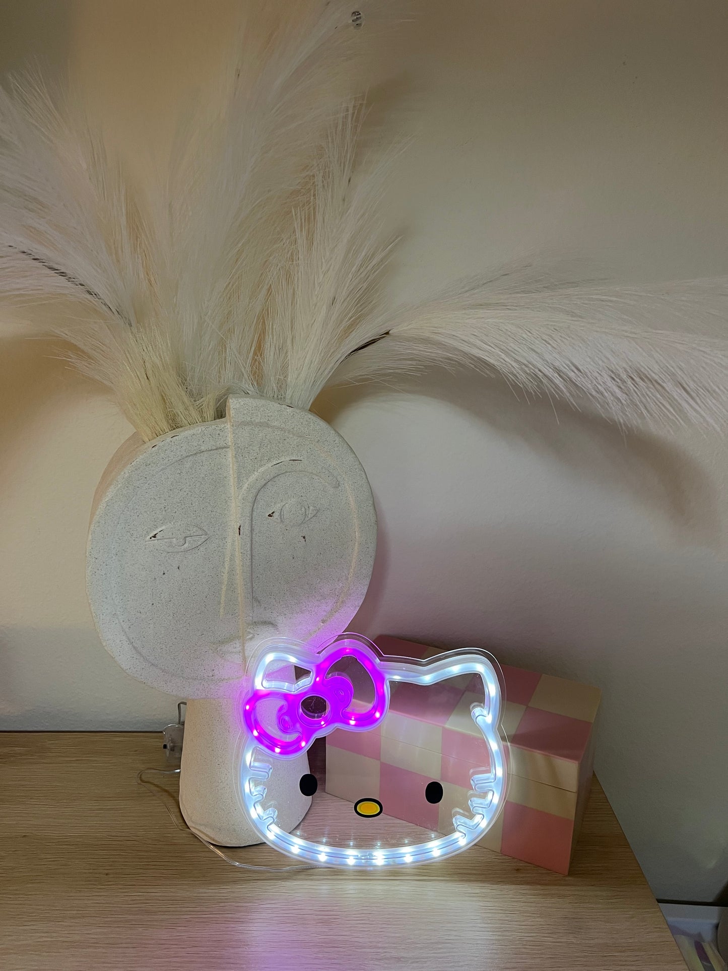 Hello Kitty LED Wall Light featuring soft pink glow and iconic face design – perfect for kawaii bedroom décor, aesthetic room makeover, or cozy dorm lighting setup. Lightweight, battery-powered LED light ideal for Hello Kitty fans and room decor lovers shopping for unique, aesthetic lighting options on Etsy, Shopify, and Google.