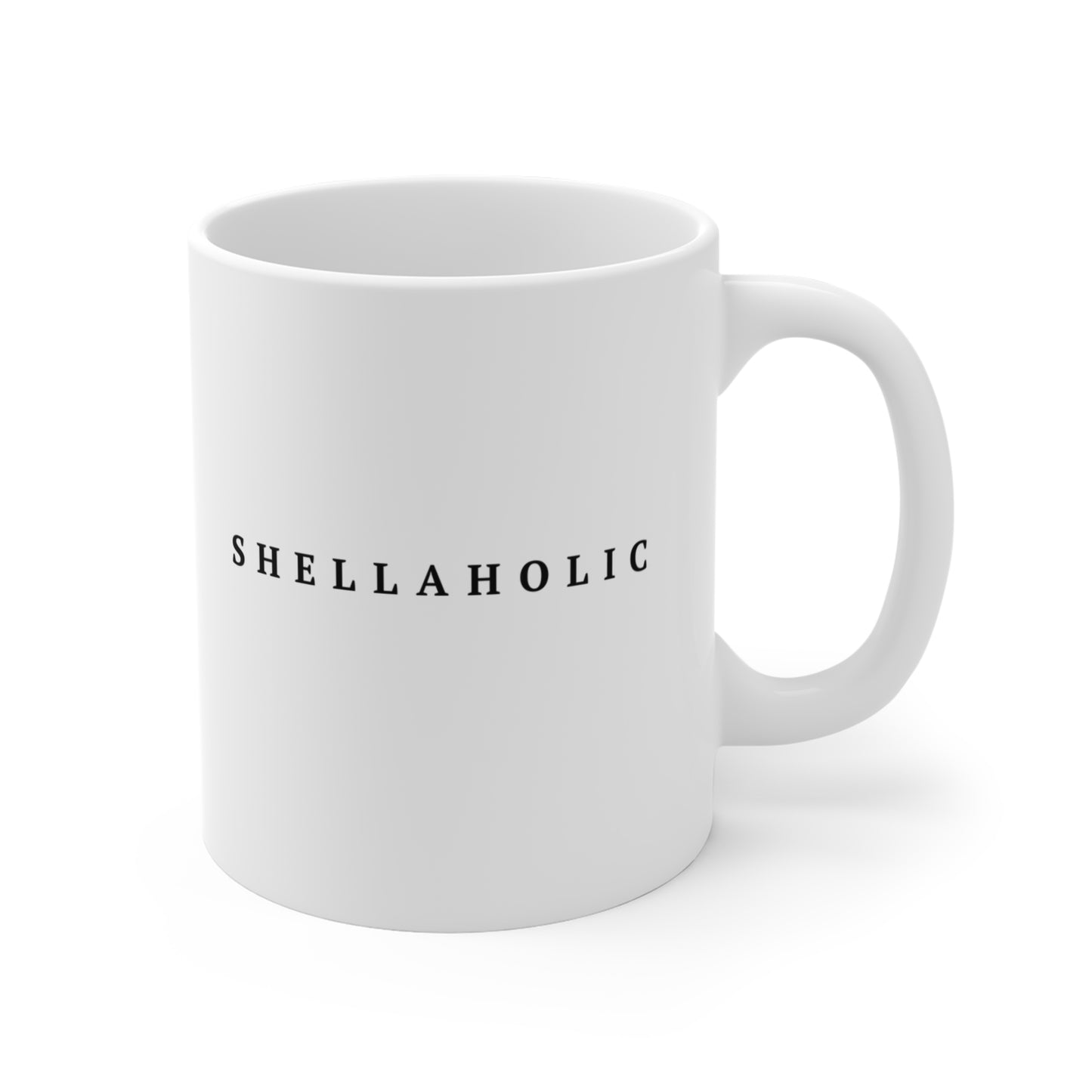 White mug with 'shellaholic' printed on a white background