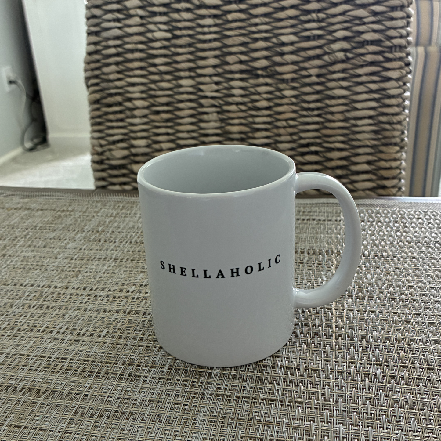 Shellaholic beach lover coffee mug with shell collector quote for sheellers and coastal gift shoppers.