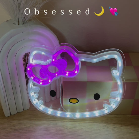 Close-up of Hello Kitty LED decorative light showing detailed facial features and glowing pink bow accent. This kawaii wall lamp creates a soft, comforting glow perfect for bedtime routines, reading nooks, or anime-themed room decor. Energy-efficient LEDs ensure cool-touch operation safe for children's rooms. The perfect blend of cute character design and functional lighting for Sanrio fans
