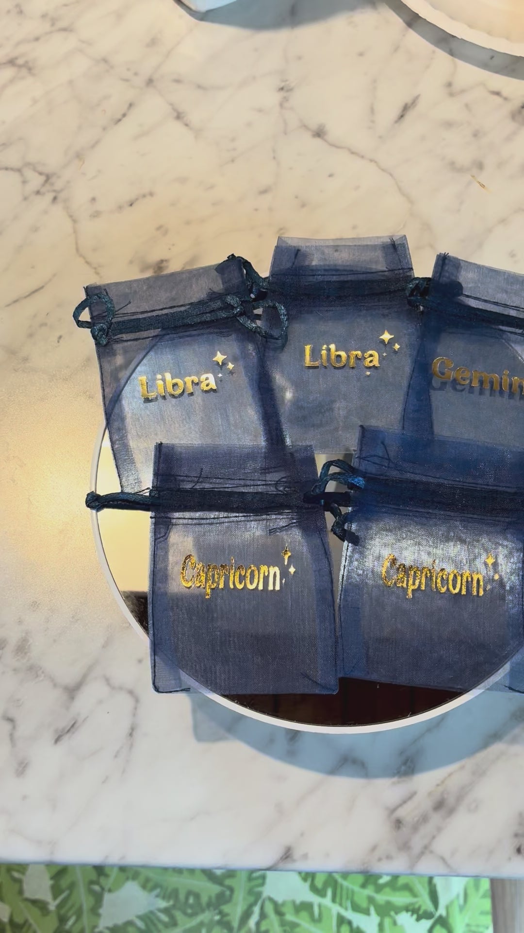 Cute zodiac sign blue organza pouch personalized with astrology sign, styled for gifting, jewelry, and crystals.